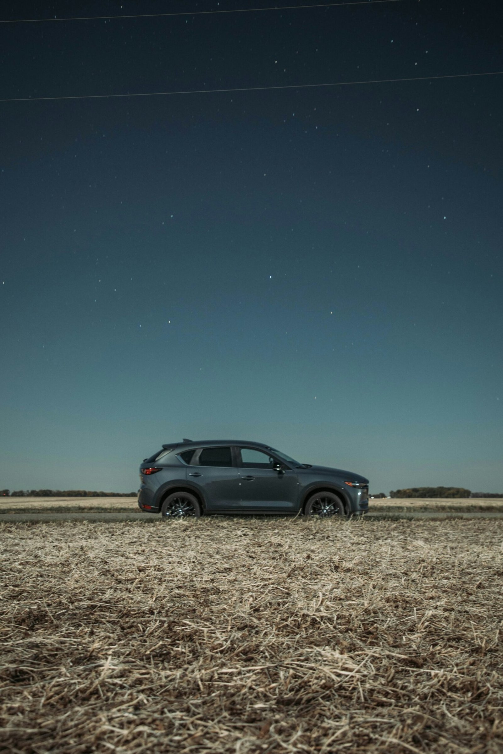 a car is parked in a field at night